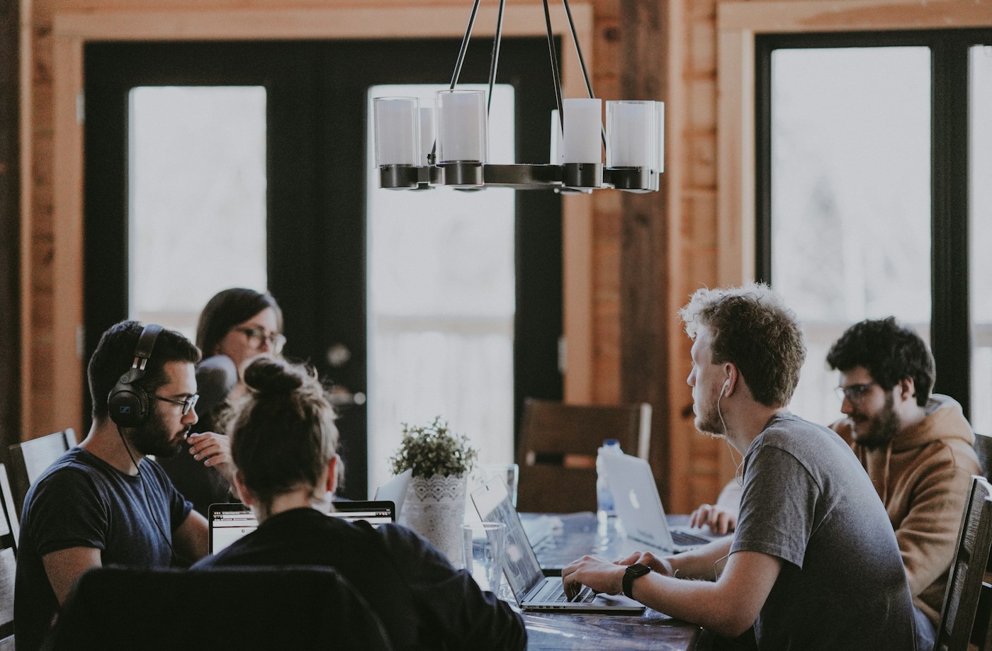 Professionals collaborating around a table in a shared workspace